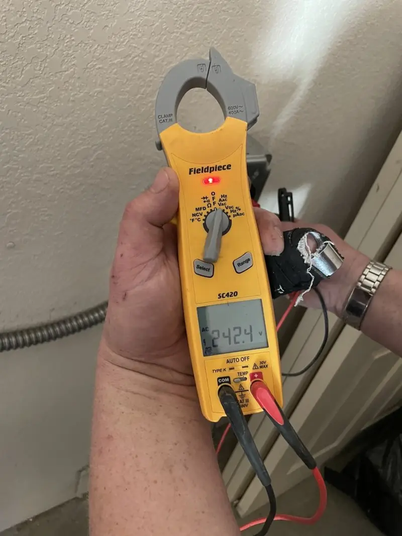 Voltage testing with clamp meter during Electrical Installation Services in Fountain